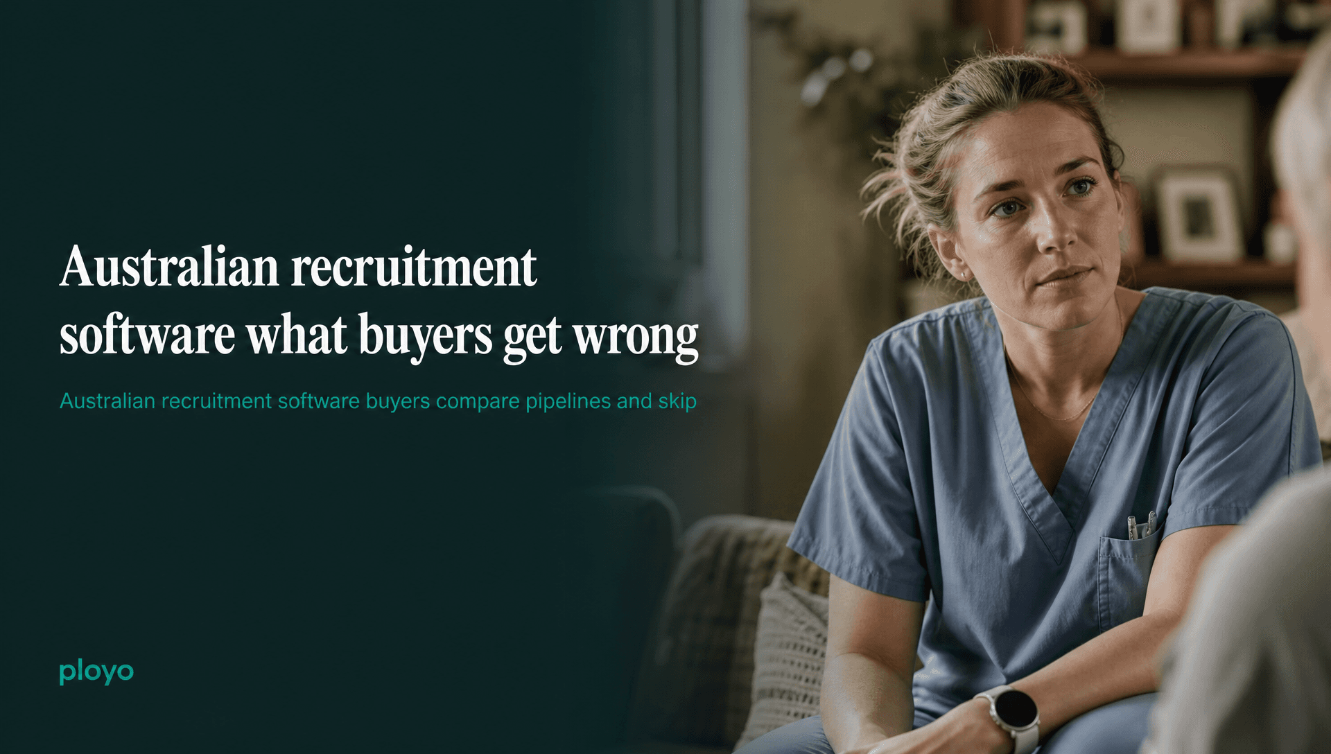 A carer or nurse in soft scrubs, mid-conversation with someone off-frame, listening rather than talking, in a warm domestic interior